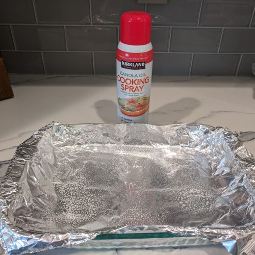 chicken parm line baking dish with foil and spray