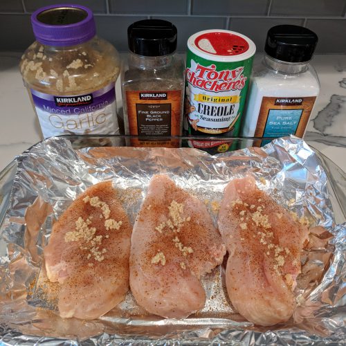 chicken parm spread minced garlic over breasts