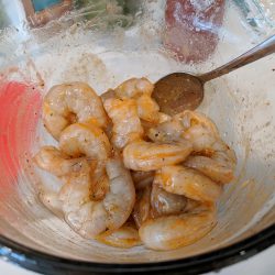toss shrimp with sirarcha and olive oil