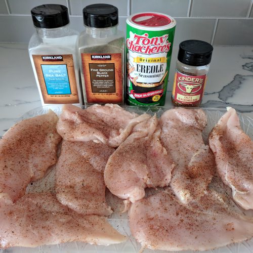 cut chicken breasts and season