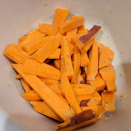 air fryer sweet potato fries toss fries in sauce
