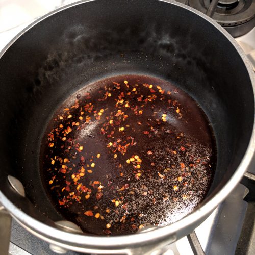 air fryer teriyaki drumettes in a small pan make sauce