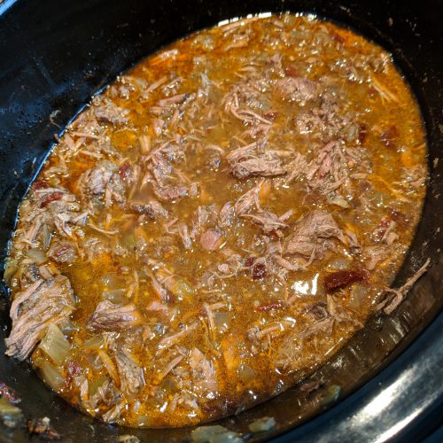 barbacoa bowls shred beef and put back in crock pot